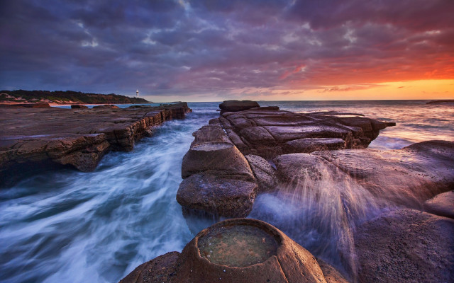 Sunset rocky beach lighthouse cloudy free wallpaper - medium preview image
