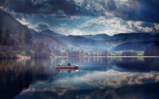 Lake mountains clouds boat person free wallpaper - medium preview image