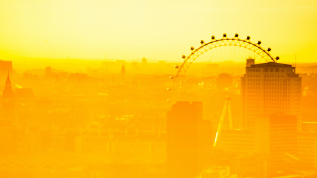 Yellow sky ferris wheel cityscape free wallpaper - medium preview image