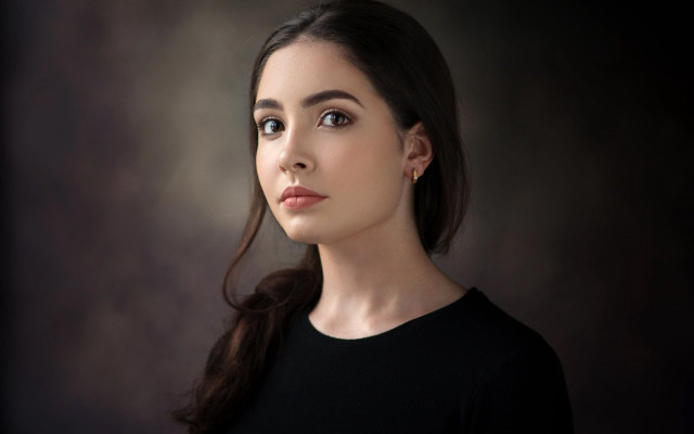 Woman black shirt serious look #2 free wallpaper - medium preview image