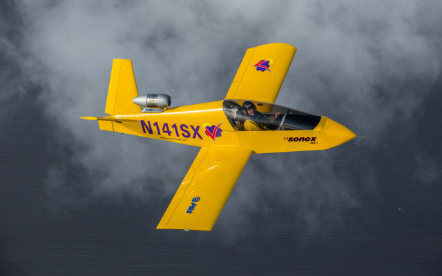 Yellow airplane cockpit cloudy sky free wallpaper - medium preview image