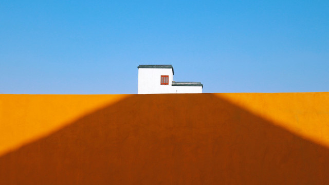 Hill building roof shadow minimalist free wallpaper - medium preview image