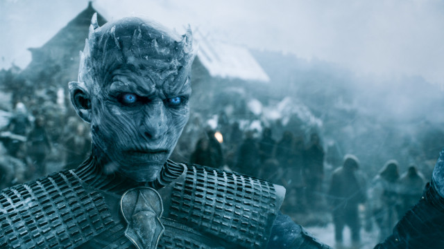 Snowy cityscape blue eyed man free wallpaper - medium preview image