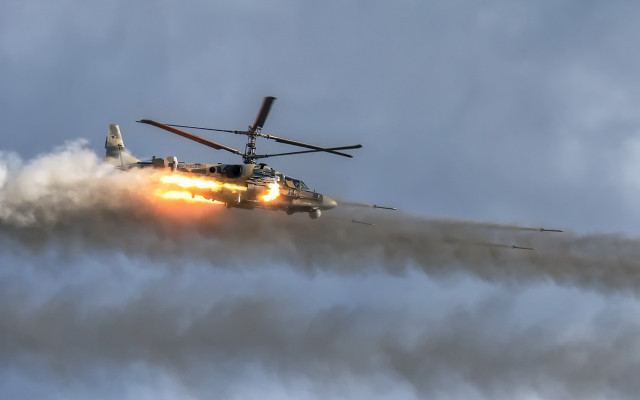 Helicopter smoke landinggear clouds mountains free wallpaper - medium preview image