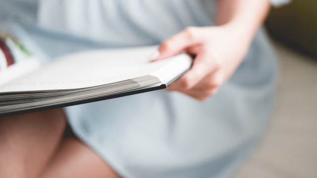 Woman dress holding book sitting free wallpaper - medium preview image