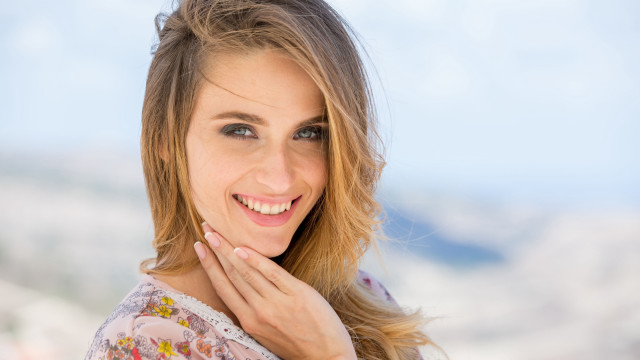 Eszter mattioni smiling mountain background free wallpaper - medium preview image