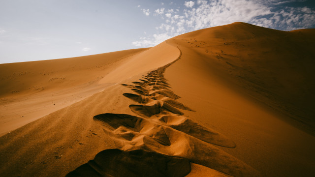 Desert footprints sky clouds mountains free wallpaper - medium preview image