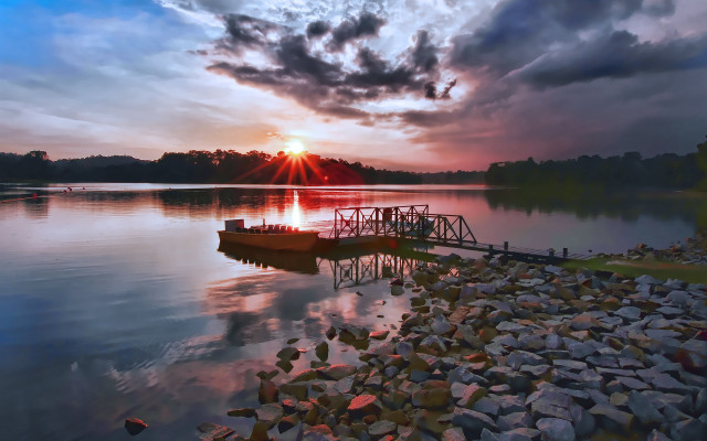 Docked boat lake sunset cloudy free wallpaper - medium preview image