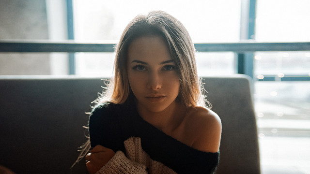 Woman couch sweater portrait blonde free wallpaper - medium preview image
