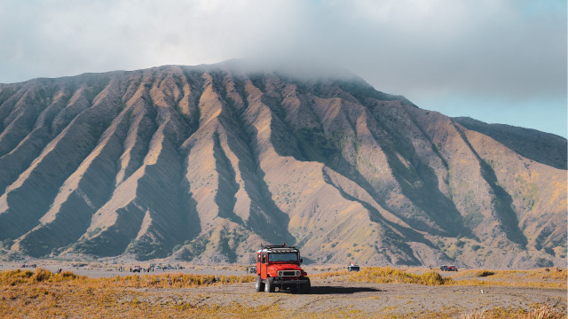 Red truck dirt road mountains free wallpaper - medium preview image