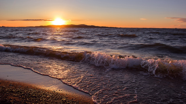 Sunset ocean waves island cityscape free wallpaper - medium preview image