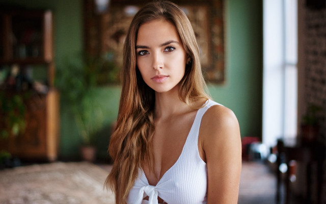 Woman white top green walls free wallpaper - medium preview image