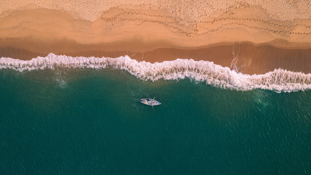 Boat beach waves sand cinematic free wallpaper - medium preview image