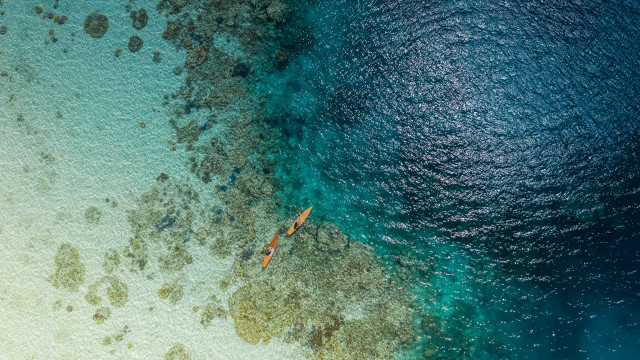 Boat beach rocks ocean night free wallpaper - medium preview image