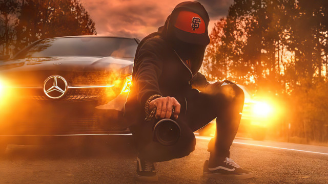 Hoodie man crouching car autumn free wallpaper - medium preview image