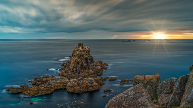 Rock formation ocean lighthouse clouds free wallpaper - medium preview image