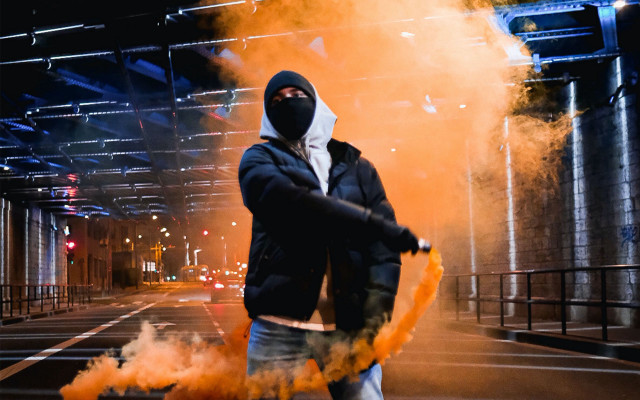 Man black jacket mask yellow free wallpaper - medium preview image