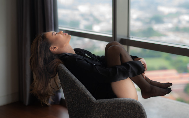 Woman sitting window city portrait free wallpaper - medium preview image