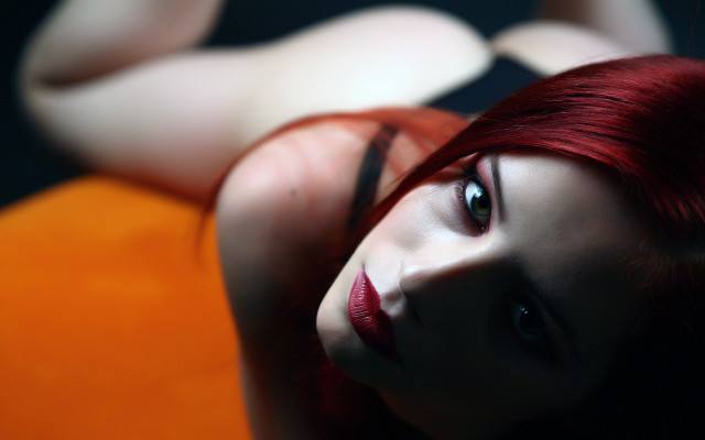 Red hair woman bed blurry free wallpaper - medium preview image