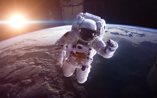 Astronaut earth horizon sun lensflare free wallpaper - medium preview image