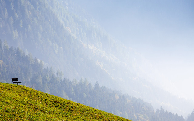 Bench grassy hill mountain foggy free wallpaper - medium preview image
