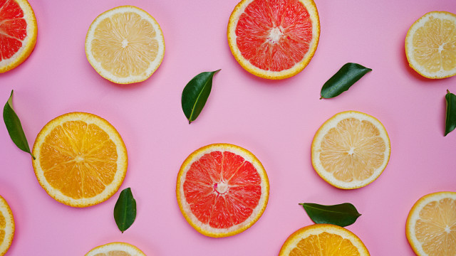 Citrus halves pink background leaves free wallpaper - medium preview image