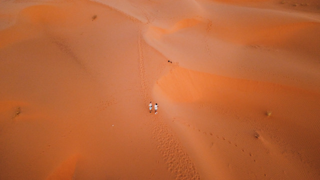 Desert people vehicle sunset sky free wallpaper - medium preview image
