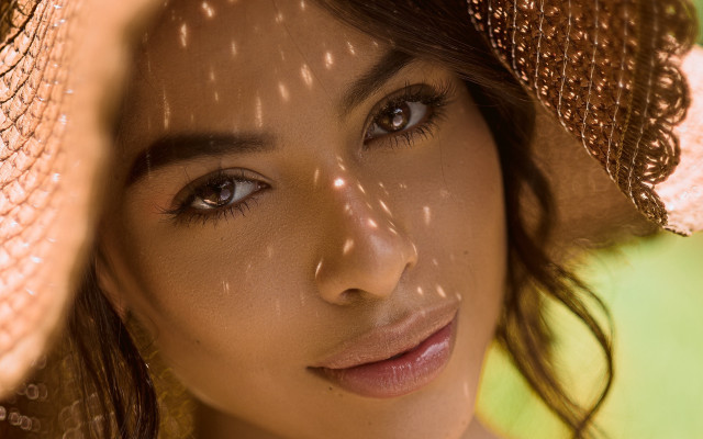 Sunlit portrait hat shadow green free wallpaper - medium preview image