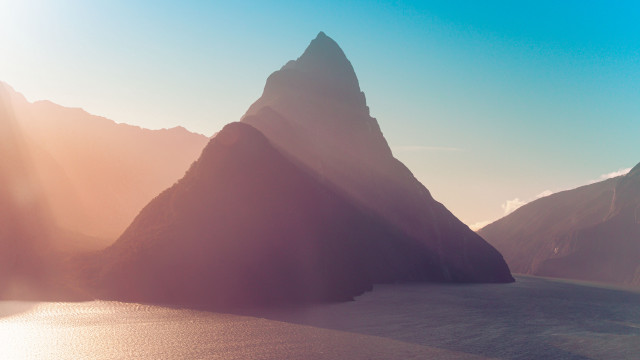 Mountain range ocean sunset beach free wallpaper - medium preview image