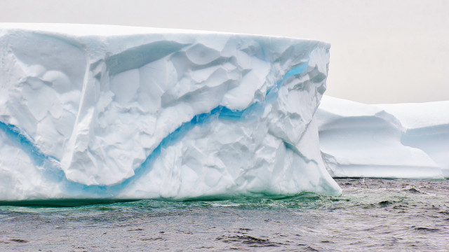 Large iceberg ocean shore boat free wallpaper - medium preview image
