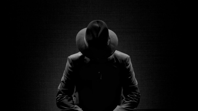 Hooded sitter darkroom black and free wallpaper - medium preview image