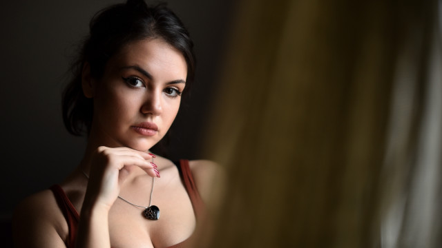 Woman necklace mirror serious portrait free wallpaper - medium preview image