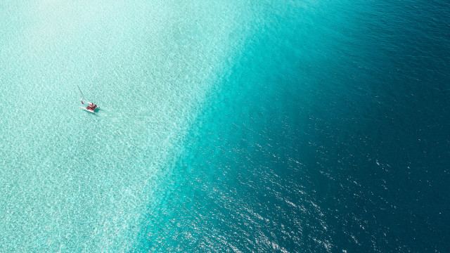 Boat water person ocean night free wallpaper for desktop - medium preview image