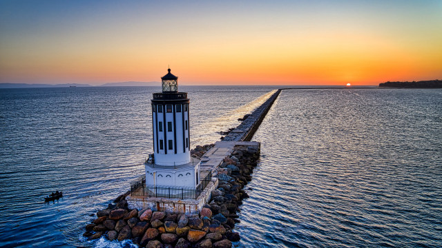 Lighthouse pier ocean sunset romanticism free wallpaper - medium preview image