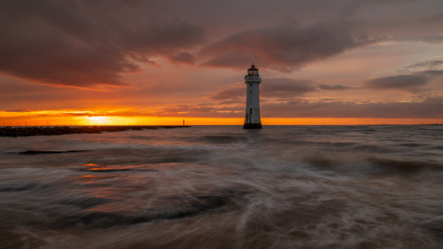 Lighthouse ocean sunset cloudy sky free wallpaper - medium preview image