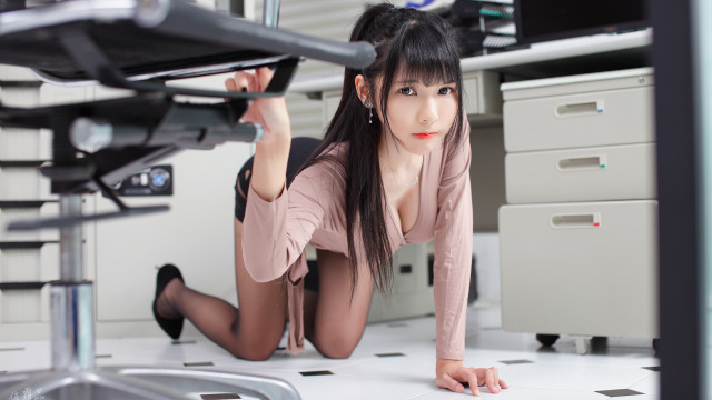 Woman pink shirt laying computer free wallpaper - medium preview image