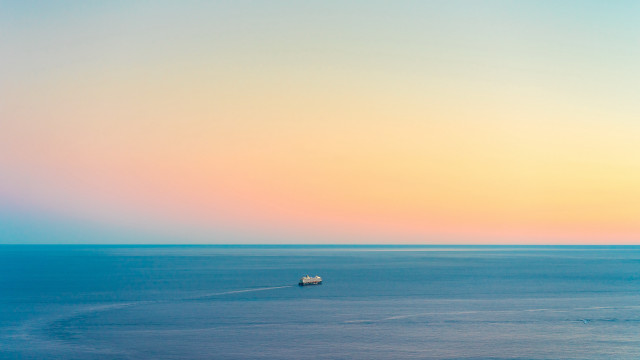 Ocean sunset hazy minimalism boat free wallpaper - medium preview image
