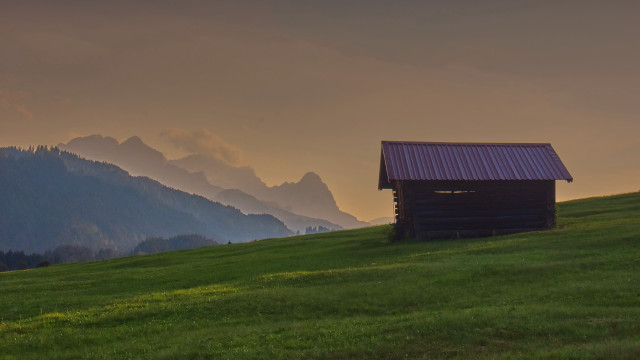 Small cabin grassy hill mountains free wallpaper - medium preview image