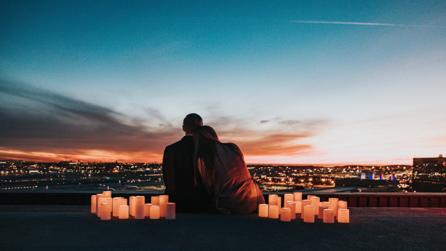 Romantic couple candles sunset cityscape free wallpaper - medium preview image