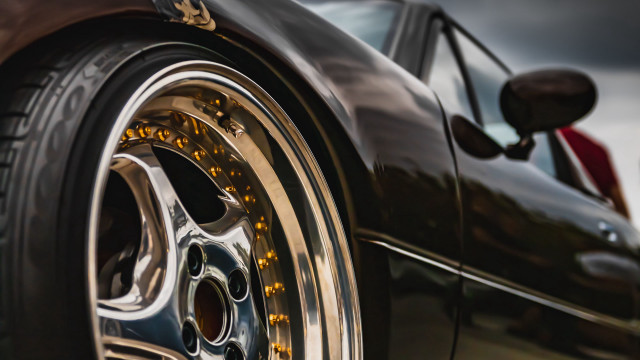 Car tire closeup cloudy sky free wallpaper - medium preview image