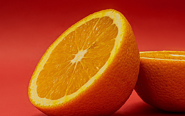 Orange halved both on red free wallpaper - medium preview image