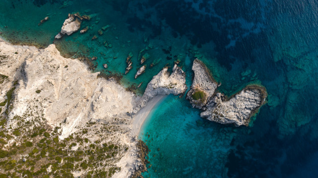 Aerial rocky beach clear water free wallpaper - medium preview image