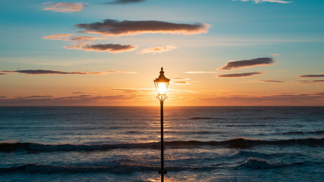 Ocean sunset lighthouse waves reflection free wallpaper - medium preview image