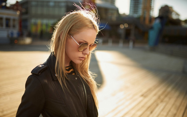 Woman blackjacket sunglasses cellphone boardwalk free wallpaper - medium preview image