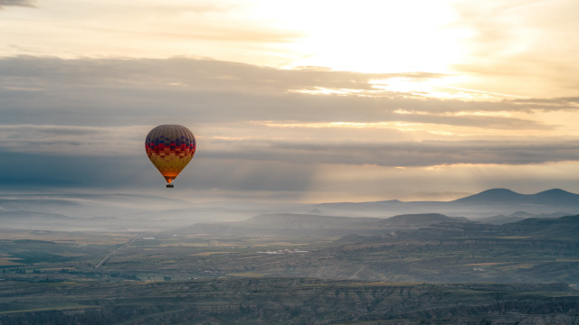 Hot air balloon valley clouds free wallpaper - medium preview image