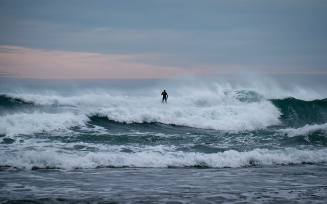 Surfboard figure ocean sunset cloudy free wallpaper - medium preview image
