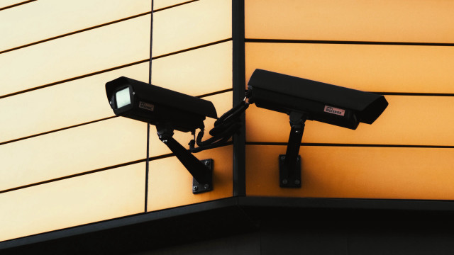 Cameras building wall yellow black free wallpaper - medium preview image