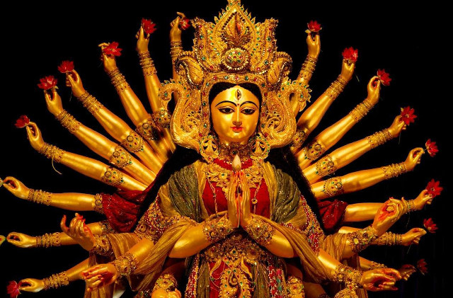Woman statue many arms outstretched free wallpaper - medium preview image