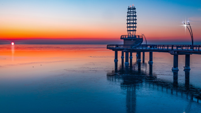Pier light tower sunset ocean free wallpaper - medium preview image