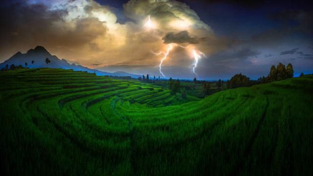 Stormy mountain landscape green field free wallpaper - medium preview image